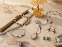 Yue TerraBrio gemstone jewelry, raw crystals, and citrine tree decor arranged in a warm editorial still life