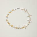 A handcrafted Yue TerraBrio necklace featuring radiant golden citrine chips, water-drop baroque pearls, and toothpick pearls set with 925 sterling silver.