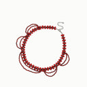 Crimson Veil black spinel and garnet layered necklace displayed with coordinating black spinel on a white background.