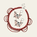 Crimson Web black spinel and garnet earrings displayed with the coordinating Crimson Veil black spinel and garnet necklace on a white background.