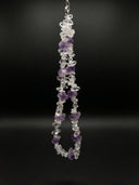 Clear quartz and amethyst necklace displayed in a full product view against a black background.
