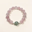 Yue TerraBrio Gentle Bloom rose quartz bracelet with green rutilated quartz focal bead and shell pearl accents.