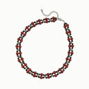Midnight Ember black spinel and red agate double-strand necklace with stainless steel extender on a cream background.