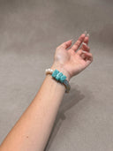 Close-up of a model wearing the blue-green amazonite and blue onyx bracelet.