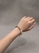Side view of a model wearing the amazonite, blue onyx, and grey moonstone bracelet.