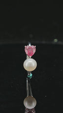 360 angled view of Heart in Bloom silver ring with heart-shaped peridot setting and freshwater pearl.