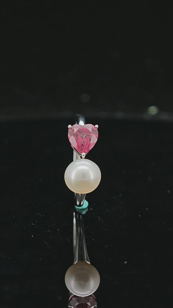 360 angled view of Heart in Bloom silver ring with heart-shaped peridot setting and freshwater pearl.