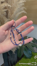 Yue TerraBrio azure Poise double-strand lapis lazuli and pearl bracelet with silver logo tag and adjustable navy cord.