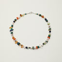 A high-vibration Yue TerraBrio necklace featuring raw Citrine tusks, Malachite, Sodalite, and 15+ organic gemstones for full-chakra alignment and intention amplification.