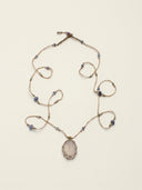 A hand-woven "Duo Bao" necklace featuring an egg-shaped Rose Quartz pendant in a macramé net, accented with 5mm vibrant multi-gemstones for heart-centered energy.