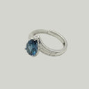 Yue TerraBrio Abyssal Wave adjustable ring with a pear-cut blue topaz, cubic zirconia accents, and a 925 sterling silver wave band.