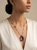Professional model styling the "Ethereal Wisdom" Amethyst necklace by Yue TerraBrio, showcasing its organic silhouette and spiritual elegance for daily mindfulness.