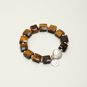 Yue TerraBrio Architectural Will bracelet with geometric tiger’s eye cubes, a freshwater baroque teardrop pearl, and sterling silver details.