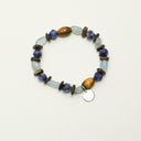 Yue TerraBrio Aromatic Sanctuary bracelet with agarwood beads, blue sodalite, aquamarine accents, tiger’s eye, and a sterling silver medallion.