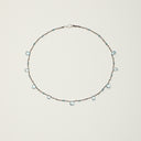 Yue TerraBrio Azure Current necklace with blue topaz drop beads, faceted topaz accents, sterling silver round beads, and an S925 silver hook clasp.