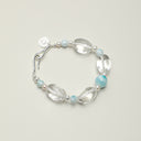 Yue TerraBrio Azure Whisper Larimar and seed pearl bracelet for throat chakra and emotional balance.