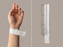 A paper strip and ruler method showing how to measure wrist size for the Yue TerraBrio bracelet size guide.