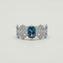 Yue TerraBrio Byzantine Crown adjustable ring with an oval London blue topaz, aqua crystal accents, and a 925 sterling silver band.