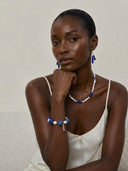 Yue TerraBrio Celestial Wisdom bracelet on a female model with raw chunky Lapis Lazuli and baroque pearls for Third Eye Chakra.