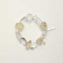 Yue TerraBrio Clear Radiance bracelet with clear quartz freeform beads, citrine accents, freshwater pearls, clear quartz tusk beads, and a sterling silver logo tag.