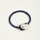 Yue TerraBrio Cosmic Sovereign bracelet with faceted lapis lazuli beads, a freshwater baroque pearl, and 925 sterling silver details.