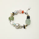 Yue TerraBrio Cosmic Symphony bracelet with prehnite, amazonite, black tourmaline, clear quartz, citrine, baroque pearls, and sterling silver details.