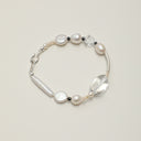 Yue TerraBrio Equilibrium Shield bracelet with Black Tourmaline and pearls for grounding and EMF protection.