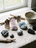 Yue TerraBrio gemstone guide display with natural stones, symbolic meanings, and the energy you choose to carry.