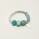 Yue TerraBrio Glacial Sovereignty bracelet with organic amazonite, oversized dumortierite beads, gray labradorite, and sterling silver details.