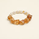Yue TerraBrio Golden Flow bracelet with Brazilian freeform citrine, citrine chips, freshwater pearls, and a sterling silver logo charm.