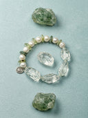 Yue TerraBrio green quartz and pearl bracelet displayed with raw green stones, inspired by natural gemstones, symbolic meaning, and personal intention.