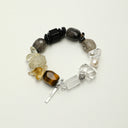 Yue TerraBrio Grounded Radiance bracelet with citrine, yellow tiger eye, black tourmaline, black agate, smoky quartz, clear quartz, freshwater pearl, and a sterling silver logo tag.