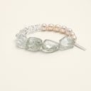 Yue TerraBrio Luminous Renewal bracelet with freshwater pearls, freeform green quartz, crushed ice clear quartz, and a sterling silver logo tag.