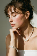 Yue TerraBrio Celestial Flow necklace, bracelet and earrings with natural baroque pearls and clear quartz for emotional balance.