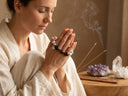 Yue TerraBrio gemstone jewelry in a mindful preparation setting, representing symbolic energy, personal intention, and meaningful ritual care.
