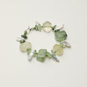 Yuè TerraBrio Radiant Flourish bracelet featuring large freeform prehnite and citrine stones with baroque long tooth pearls and Thai silver for heart healing and abundance.