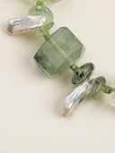 Close-up of freeform prehnite and long tooth baroque pearls in the Radiant Flourish bracelet.