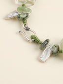 Close-up of the Thai silver hook closure with prehnite and long tooth baroque pearls.