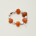 Yuè TerraBrio Ember Pulse bracelet featuring chunky Persian Red Agate and water drop Baroque pearls with a Thai silver clasp, temple-blessed for vitality and grounding.