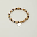 Yue TerraBrio Sandy Coast bracelet with ivory trochus shell beads, faceted tiger’s eye accents, and a sterling silver tag.