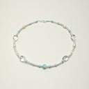 Yue TerraBrio Serene Azure healing necklace with Larimar, seed pearls, and clear quartz for throat chakra.