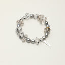 Yue TerraBrio Shadow Clarity bracelet with black phantom quartz double points, black phantom quartz round beads, gray rice pearls, and a sterling silver logo tag.
