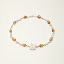 A temple-consecrated necklace featuring raw Brazilian Citrine, Petal Baroque pearls, and Toothpick pearls with 925 sterling silver accents for wealth and joy.
