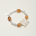 A temple-consecrated bracelet featuring freeform Brazilian Citrine, Petal Baroque pearls, and a custom engravable S925 sterling silver tag for wealth and manifestation.