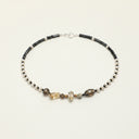 Yue TerraBrio Solar Citadel necklace with raw citrine, smoky quartz, black mineral accents, geometric freshwater pearls, Dalmatian stone discs, and a sterling silver clasp.