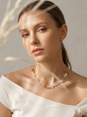 Yue TerraBrio Solar Clarity necklace on model with Brazilian Citrine and multi-form clear quartz for abundance and focus.