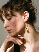 Yue TerraBrio Solar Echo earrings on model with Brazilian Citrine and sculptural silver for Solar Plexus and joy.