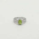 Yue TerraBrio Solstice Radiance adjustable ring with an oval peridot, cubic zirconia halo, and a 925 sterling silver band.
