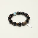 Yue TerraBrio Sovereign Sanctuary bracelet with faceted black onyx, larimar, agarwood accents, and a sterling silver bar charm.