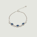 Yue TerraBrio Sovereign Vision bracelet with three royal blue sapphires, micro-pavé marquise silver links, and a sterling silver heart tag.